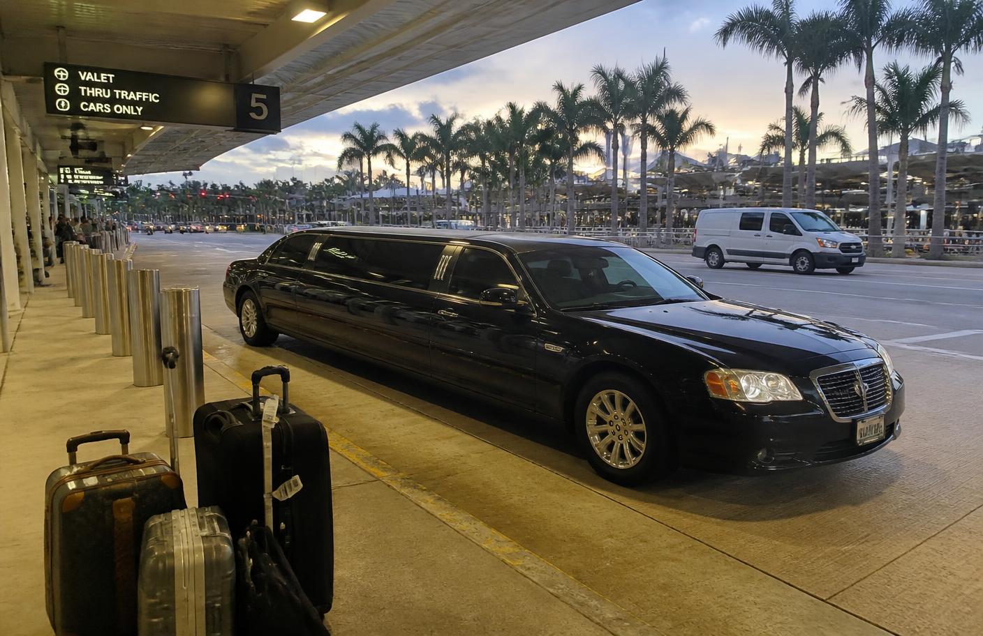 Stretch limousine at a South Florida airport terminal curb