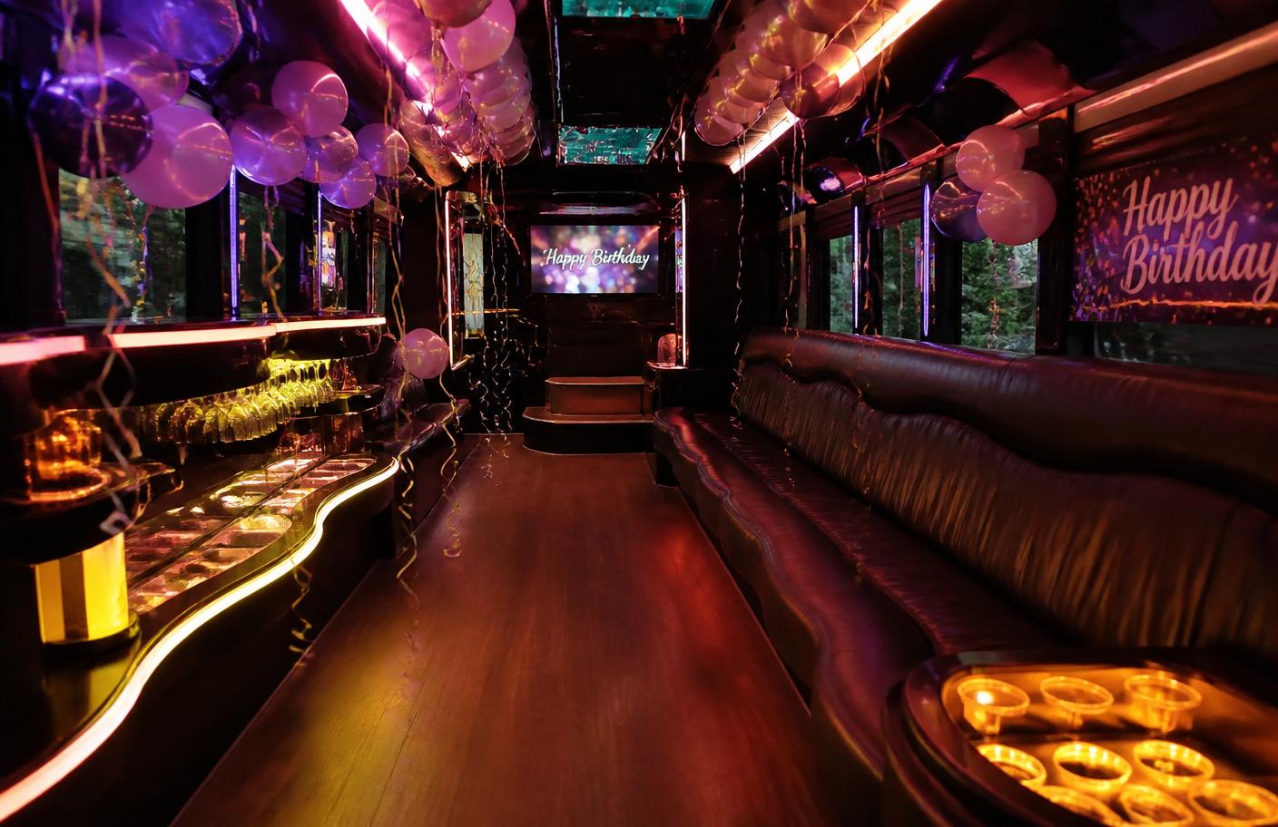 Party bus interior decorated with balloons and streamers